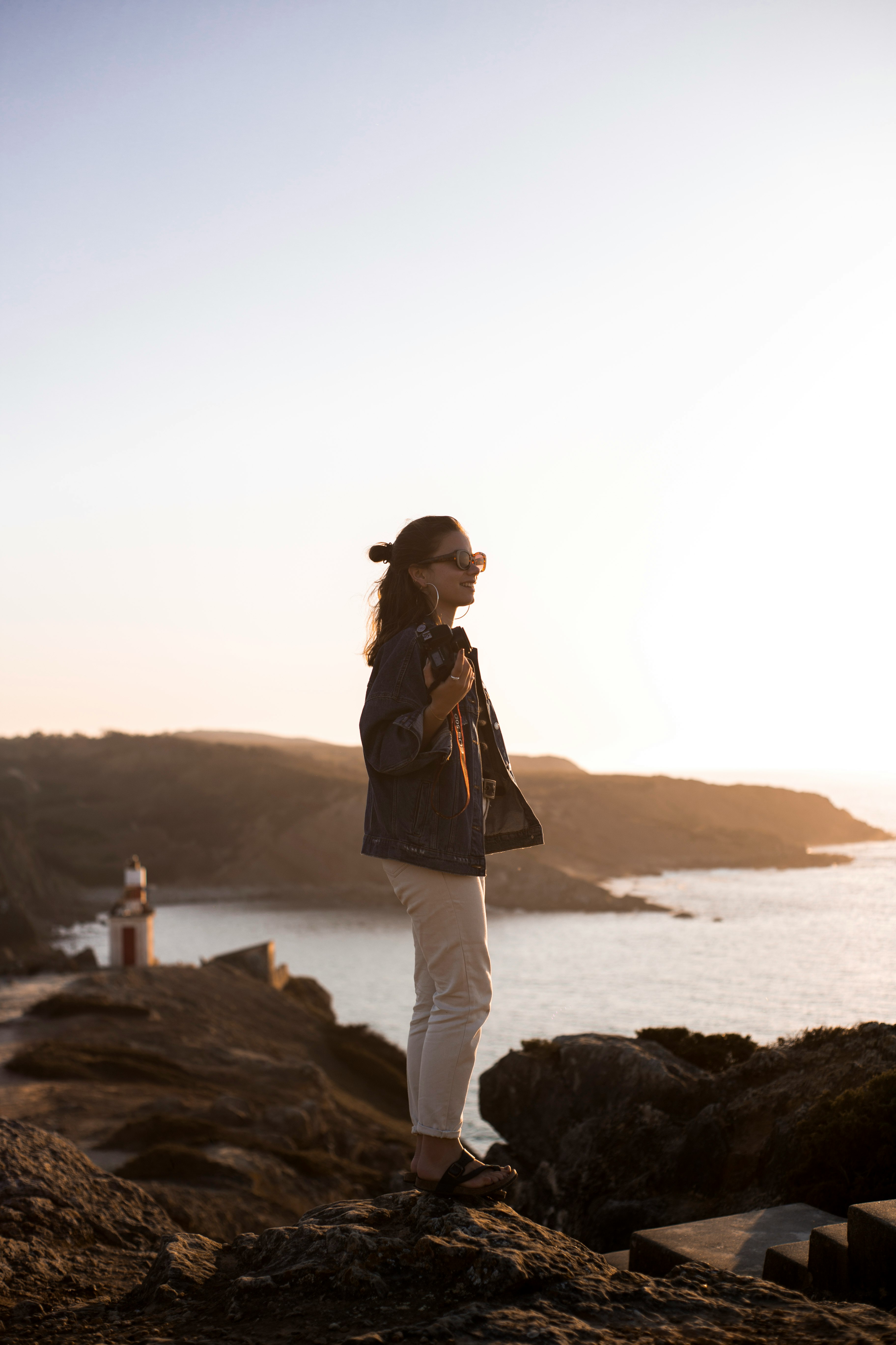 woman standing on boulders